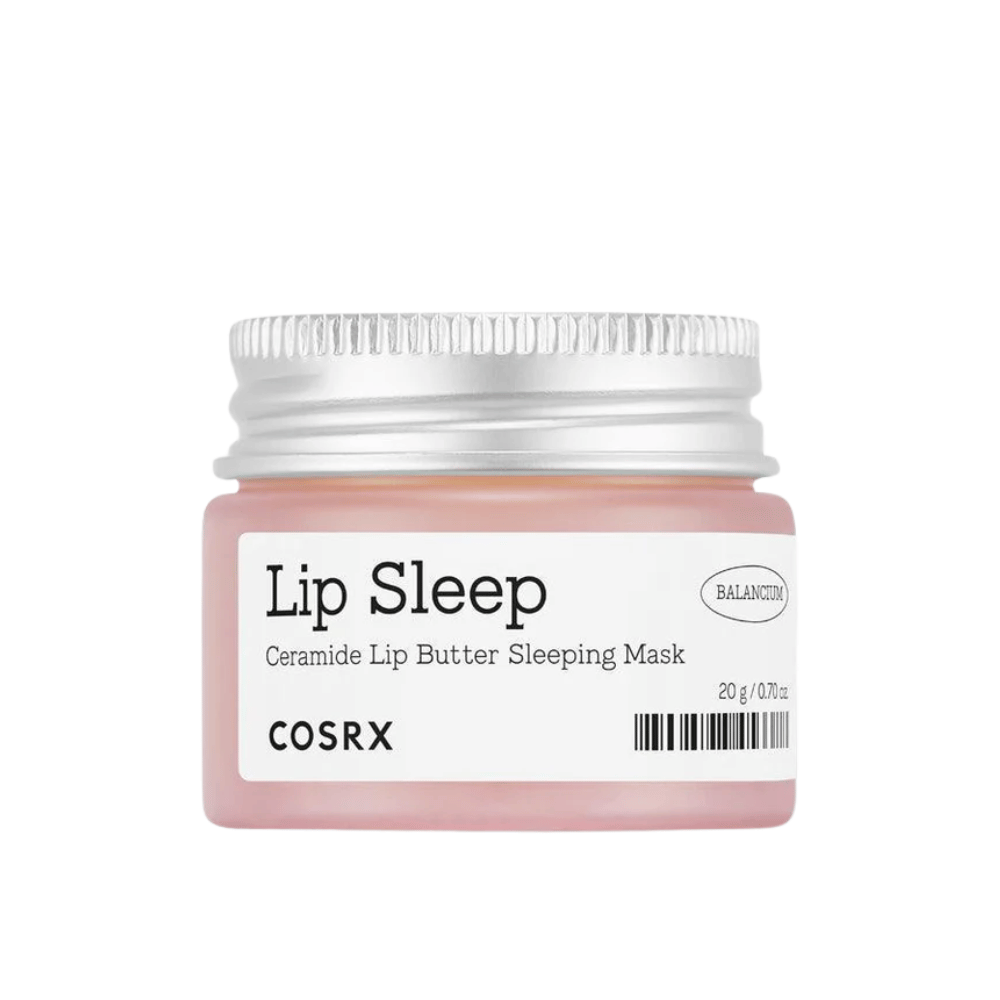 COSRX Lip Sleep Ceramide Lip Butter Sleeping Mask in rosa Dose mit silbernem Deckel. Eine duftfreie, nährende Nachtmaske für weiche, mit Feuchtigkeit versorgte Lippen.