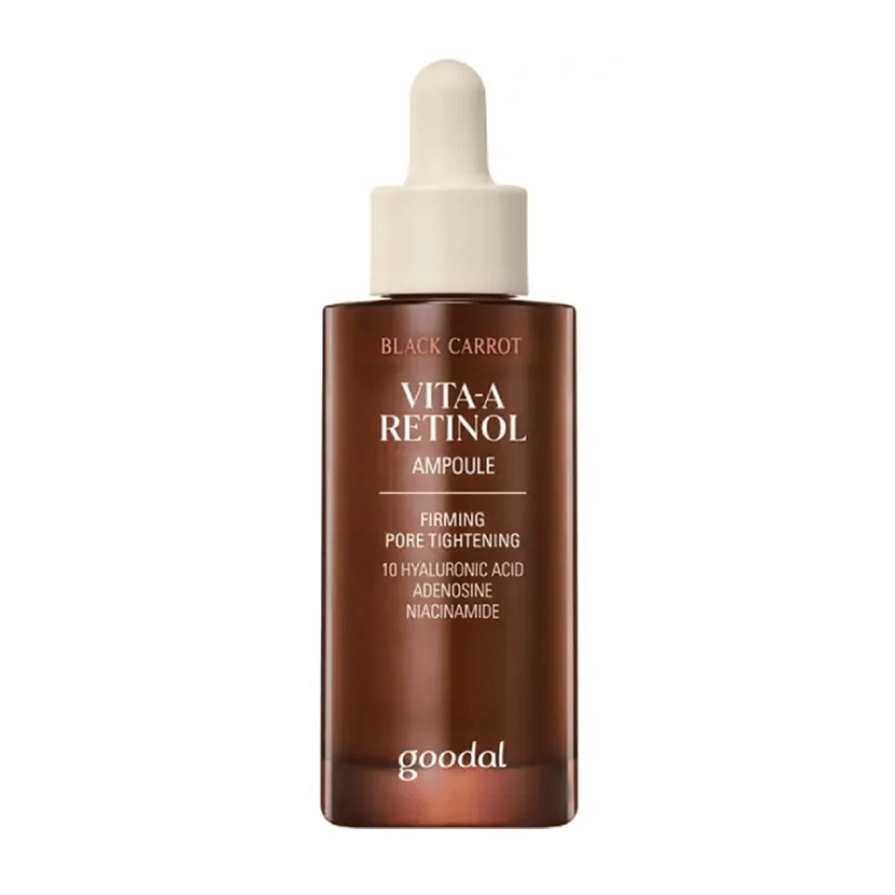 Die Flasche mit Goodal Black Carrot Vita-A Retinol Firming Ampoule wird angezeigt. Sie hat eine beige Pipette und eine dunkelbraune Flasche. Das Etikett beschreibt das Produkt als "Vita-A Retinol Ampoule" und nennt Eigenschaften wie "Firming Pore Tightening", sowie die Inhaltsstoffe 10% Hyaluronsäure, Adenosin und Niacinamid.