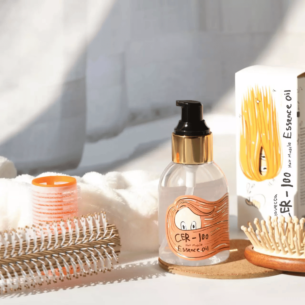 Elizavecca CER-100 Hair Muscle Essence Oil Styling – feuchtigkeitsspendendes Haaröl, das hilft, Frizz zu reduzieren, Glanz zu verleihen und das Haar beim Styling zu schützen.