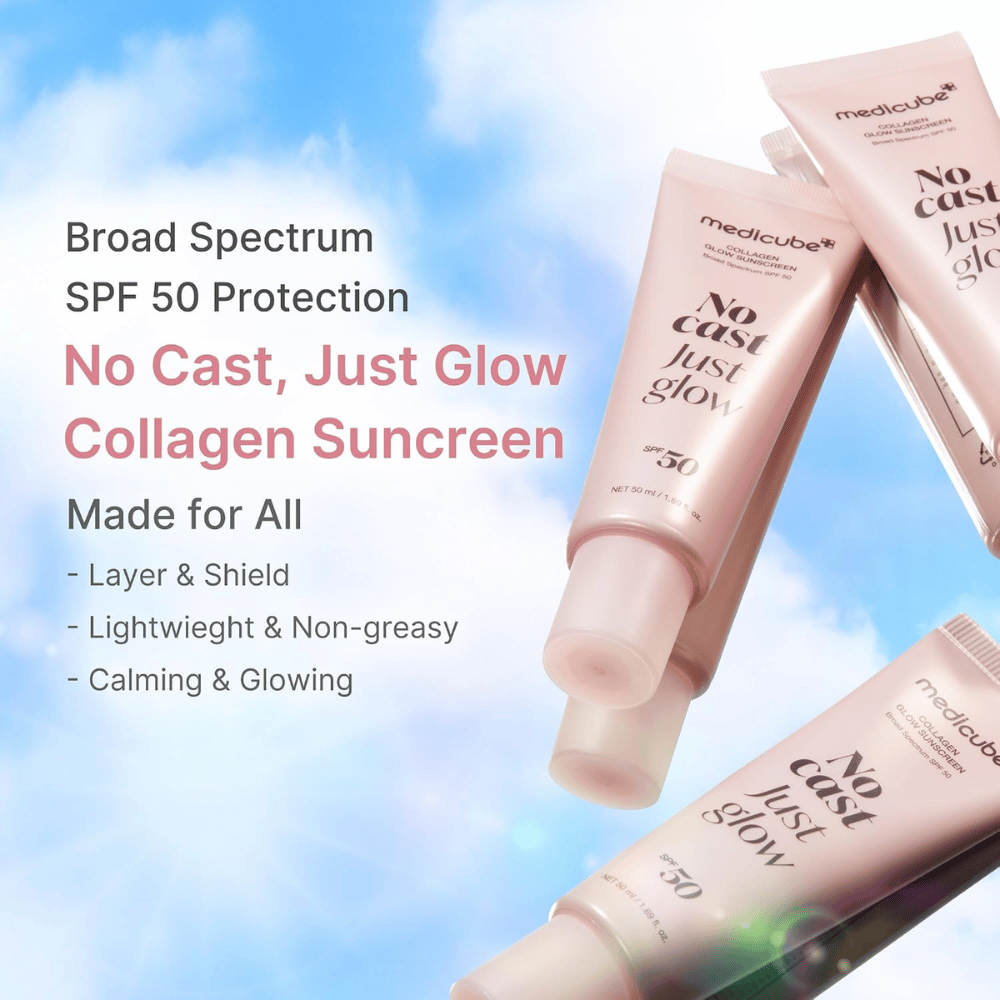 Medicube Collagen Glow Sunscreen SPF 50, leichter Sonnenschutz mit Glow-Effekt ohne weißen Film. Rosa Sonnenschutztuben vor blauem Himmel.