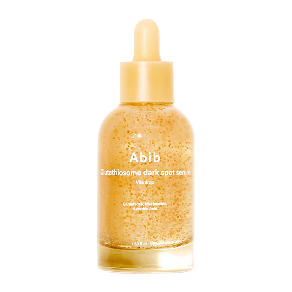 Produktbild von Abib Glutathiosome Dark Spot Serum Vita Drop in einer durchsichtigen Glasflasche mit gelber Pipette und sichtbaren Mikrokapseln im Serum.