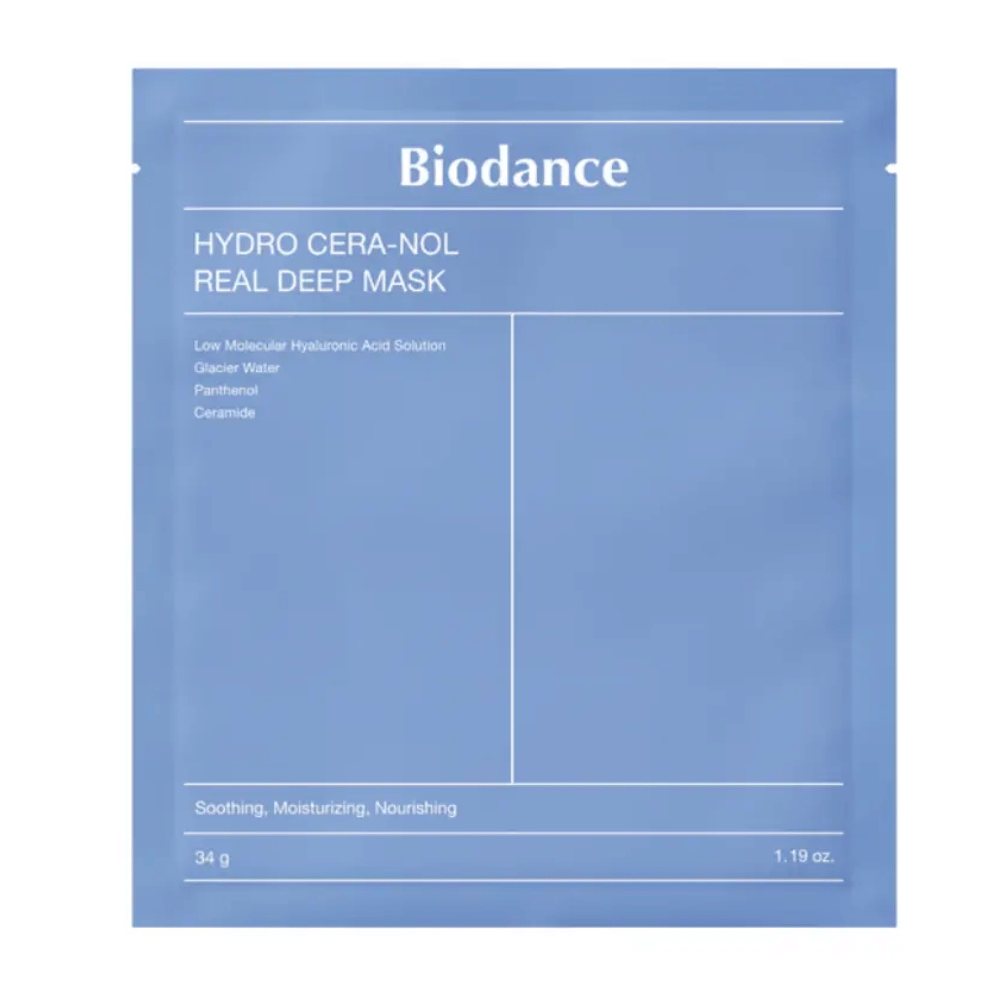 Die Verpackung zeigt "Biodance Hydro Cera-Nol Real Deep Mask". Es ist eine beruhigende, feuchtigkeitsspendende und pflegende Gesichtsmaske, die niedermolekulare Hyaluronsäure, Gletscherwasser, Panthenol und Ceramide enthält. Das Design ist einfach in einem beruhigenden Blauton.