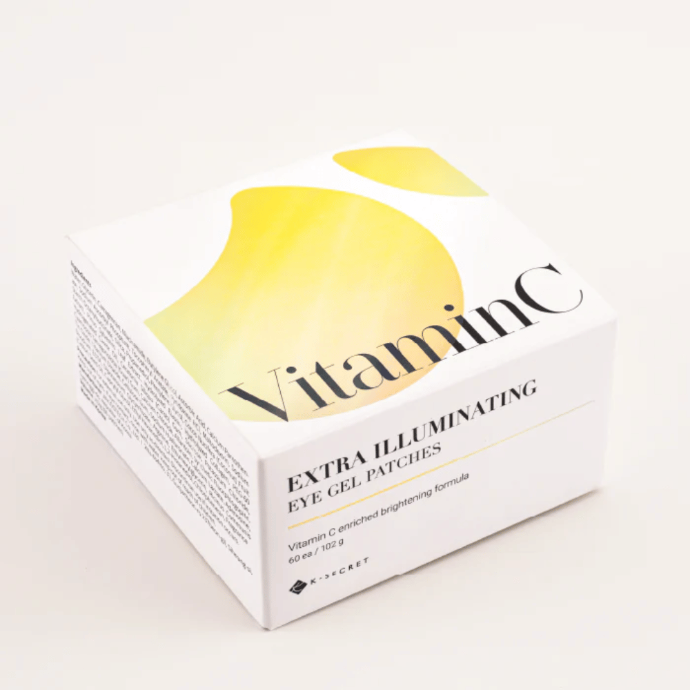 Verpackung von K-Secret Extra Illuminating Eye Gel Patches mit Vitamin C in weißem und gelbem Design.