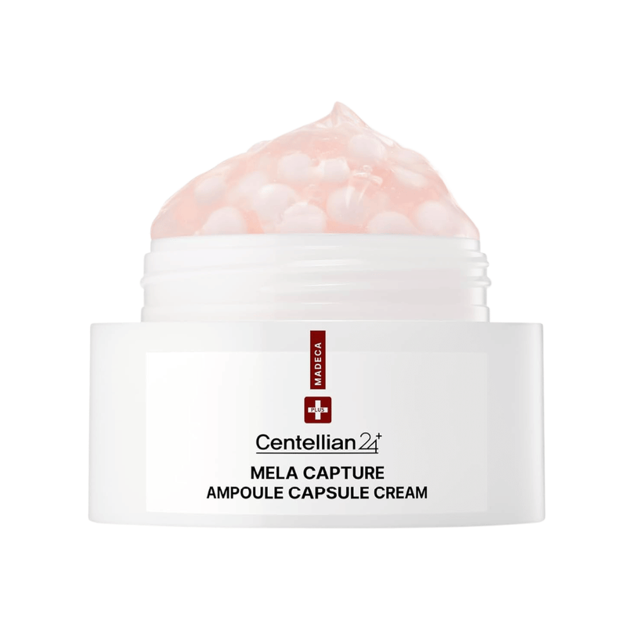 Nahaufnahme von Centellian24 Madeca Mela Capture Ampoule Capsule Cream, die die rosa Gelcreme mit eingekapselten Ampullenkugeln im Tiegel zeigt.
