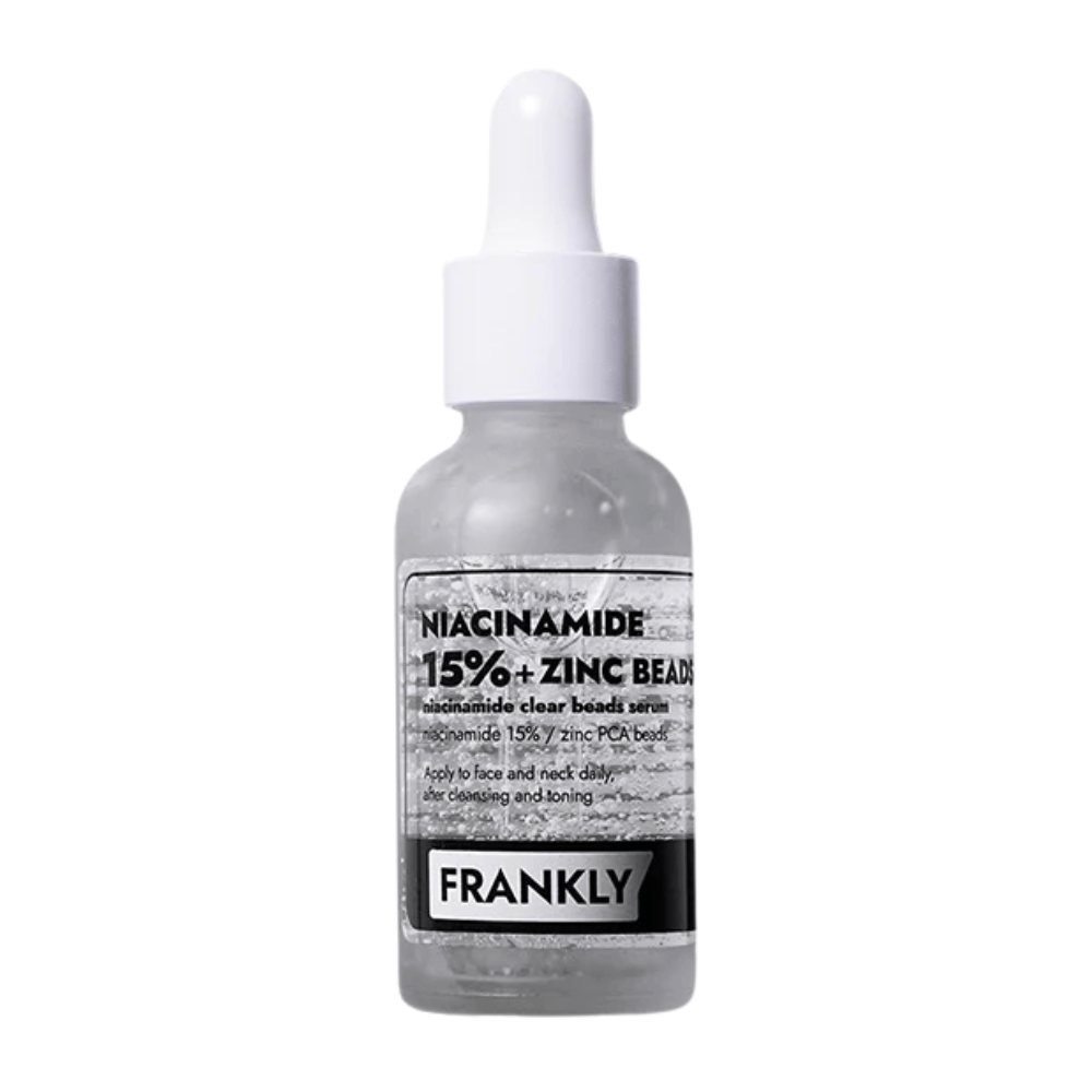Produktbild von FRANKLY Niacinamid 15% + Zinkperlen Serum in Glasflasche mit Pipette. Ein Serum, das ausgleicht, beruhigt und die Hautklarheit verbessert.