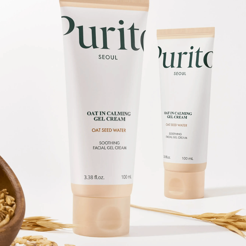 Purito Oat-In Calming Gel Cream in beiger Tube, platziert mit Haferkörnern. Beruhigt empfindliche Haut mit Haferwasser und leichter Gel-Textur.