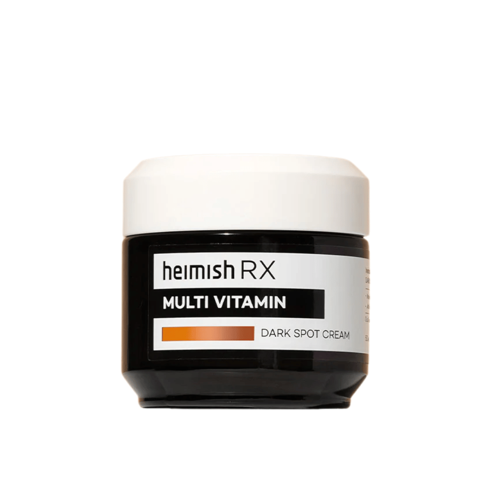 Heimish RX Multi Vitamin Dark Spot Cream in einem stilvollen schwarzen Tiegel mit weißem Deckel. Eine mit Multivitaminen angereicherte Gesichtscreme, entwickelt, um dunkle Flecken zu reduzieren und den Hautton auszugleichen.