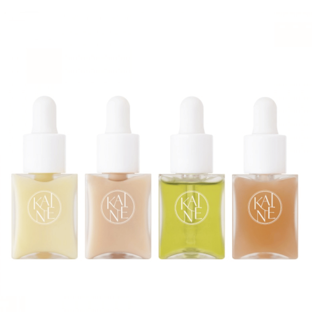Vier bunte Serumflaschen von KAINÉ Serum Discovery Kit mit Pipettenverschluss, entworfen, um verschiedene Hautbedürfnisse in einer minimalistischen und stilvollen Verpackung zu erfüllen.