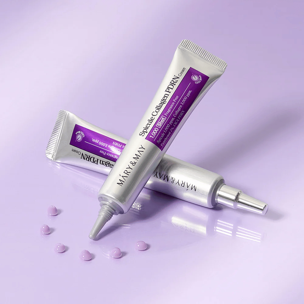 Mary & May Spicule Collagen PDRN Cream in mehreren Tuben auf lila Hintergrund, intensiv regenerierende Gesichtscreme mit Spicule-Technologie und Kollagen.