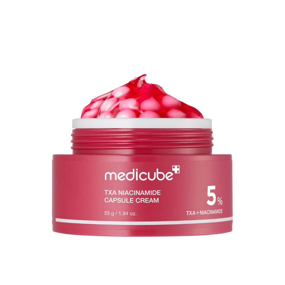 Medicube TXA Niacinamide Capsule Cream in einem Glas mit rosa Kapseln in Gelform, deutlich gekennzeichnet mit 5 % TXA + Niacinamid.